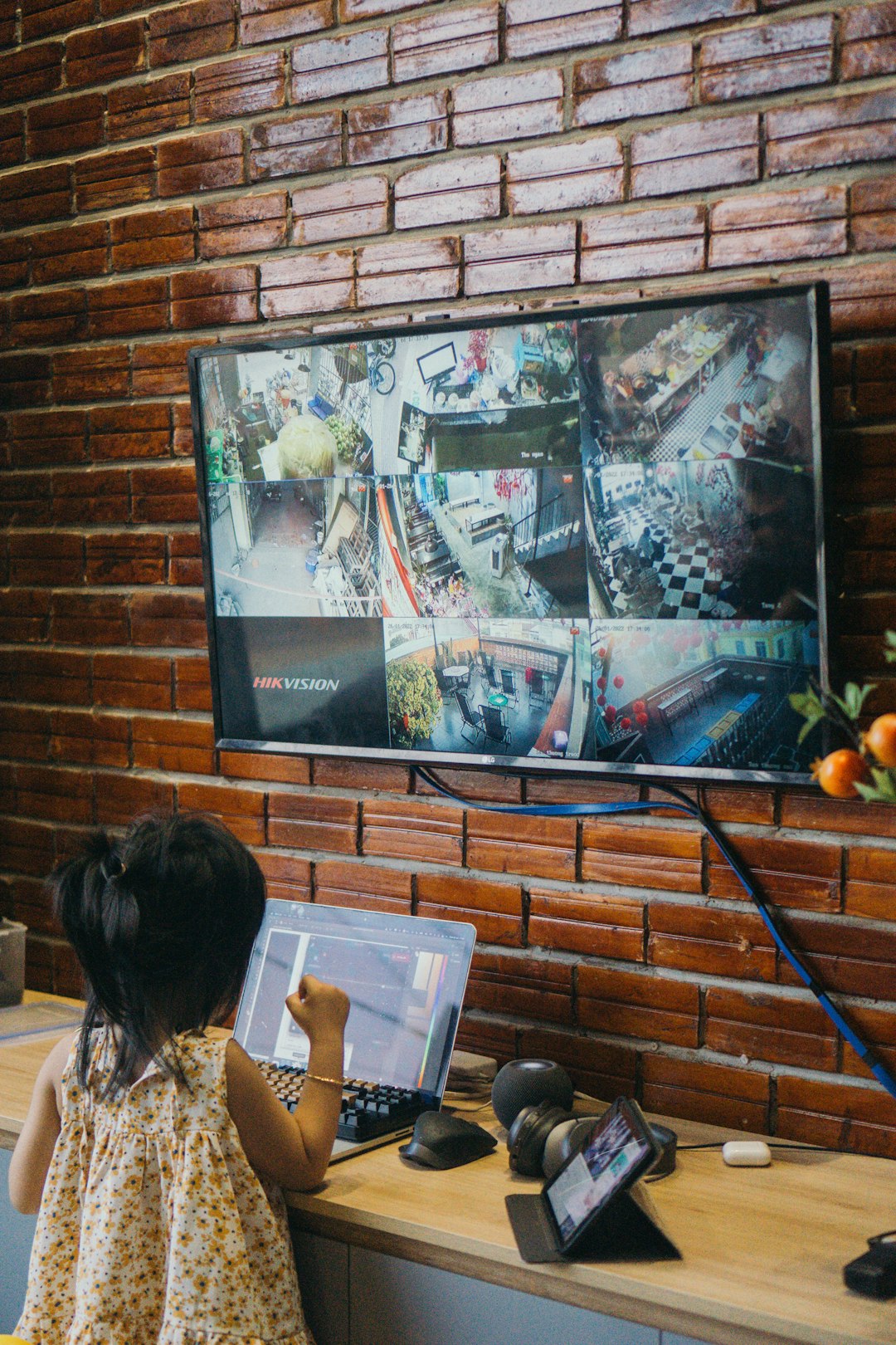 a-little-girl-sitting-in-front-of-a-flat-screen-tv-n-wddodubrq