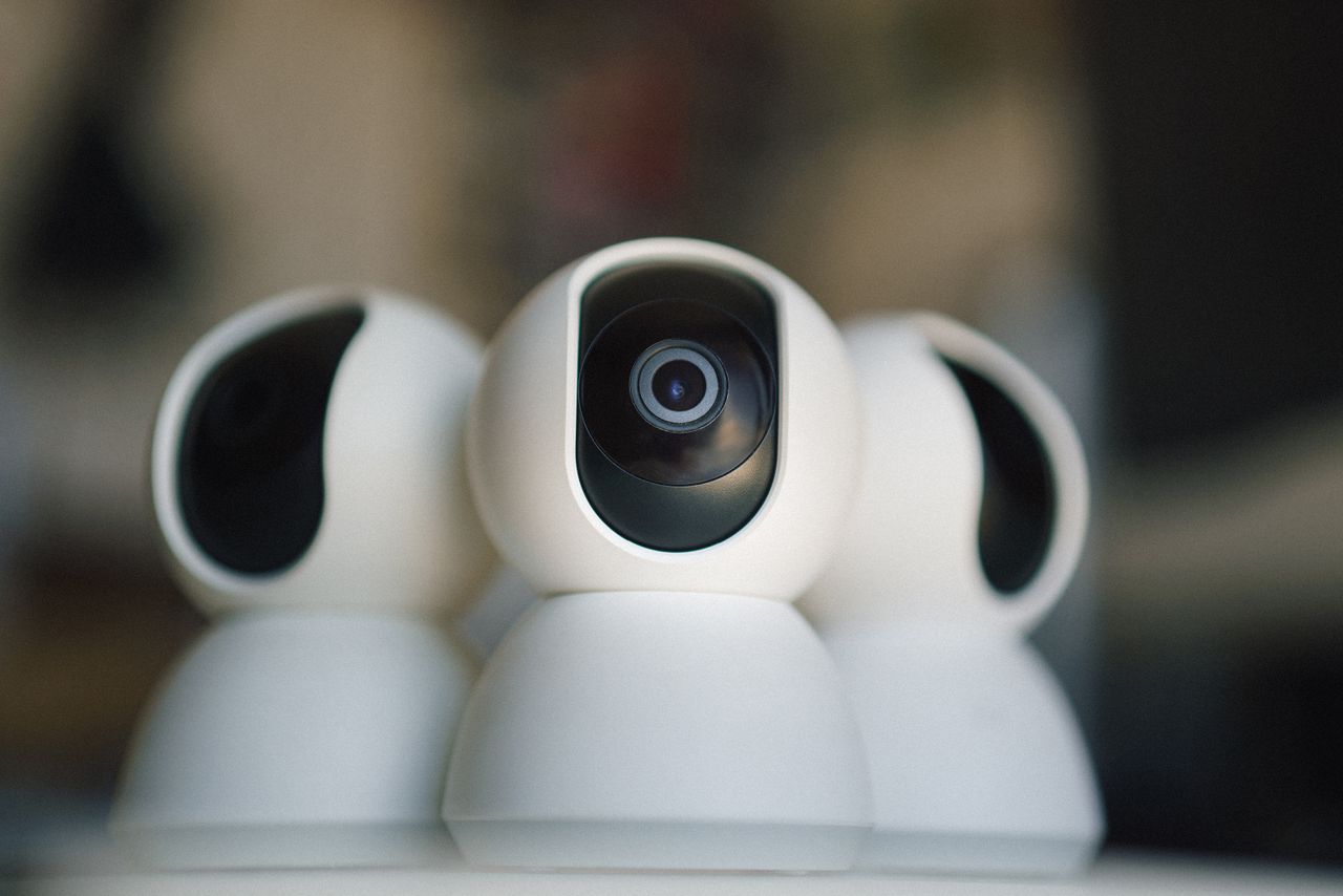 Close-up of sleek security cameras ensuring safety and privacy in indoor settings.